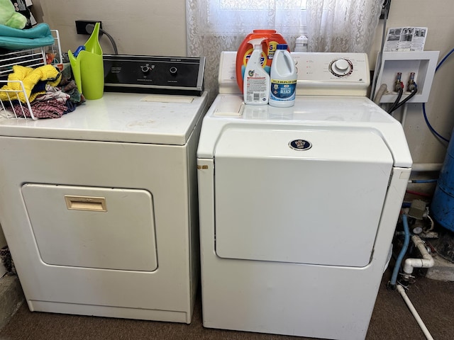 laundry area with washer and clothes dryer and laundry area