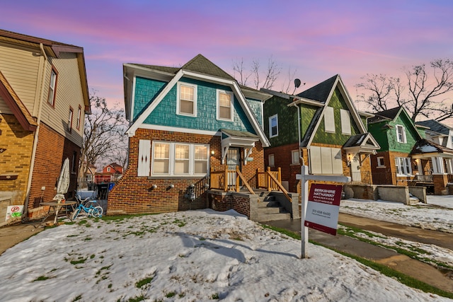 view of front of property featuring brick siding