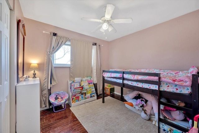 bedroom featuring wood finished floors and a ceiling fan