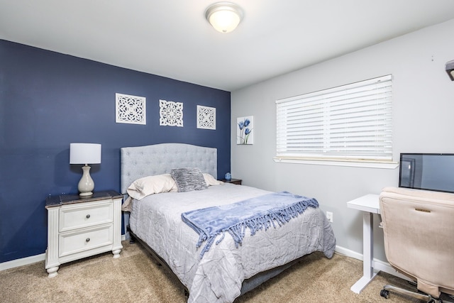 bedroom with carpet and baseboards