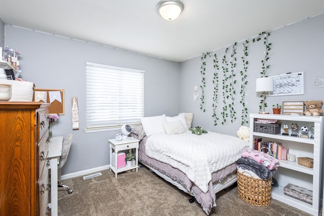 carpeted bedroom with visible vents and baseboards