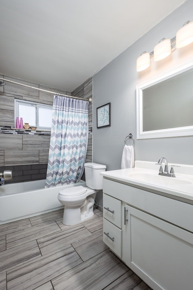 full bathroom with vanity, toilet, and shower / bath combo