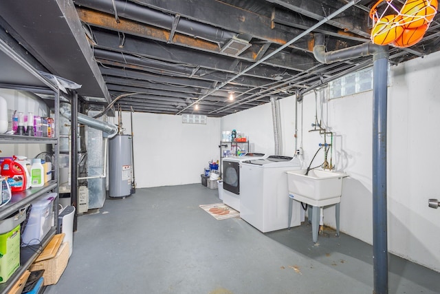 unfinished below grade area with washer and dryer, water heater, and a sink