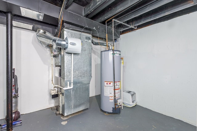 utility room featuring gas water heater and heating unit