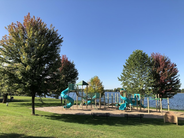 community jungle gym with a yard