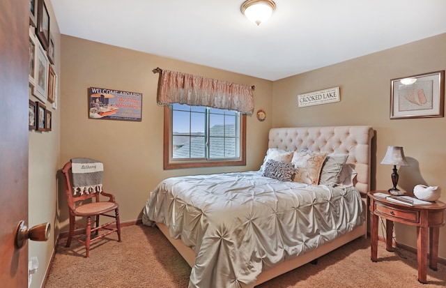 carpeted bedroom with baseboards