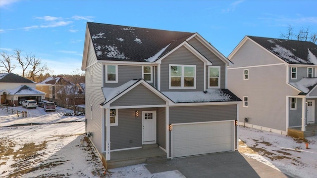 view of front facade featuring a garage, aphalt driveway, a porch, and a shingled roof