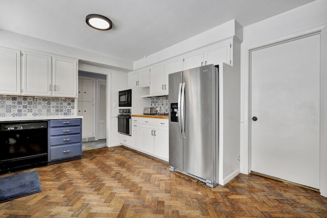 kitchen with black appliances, backsplash, light countertops, and white cabinetry