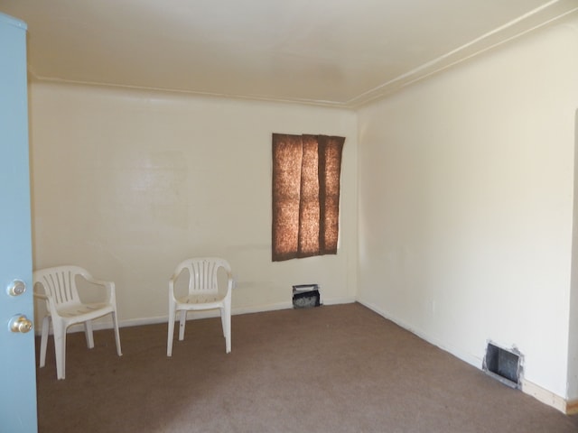 spare room with carpet and baseboards