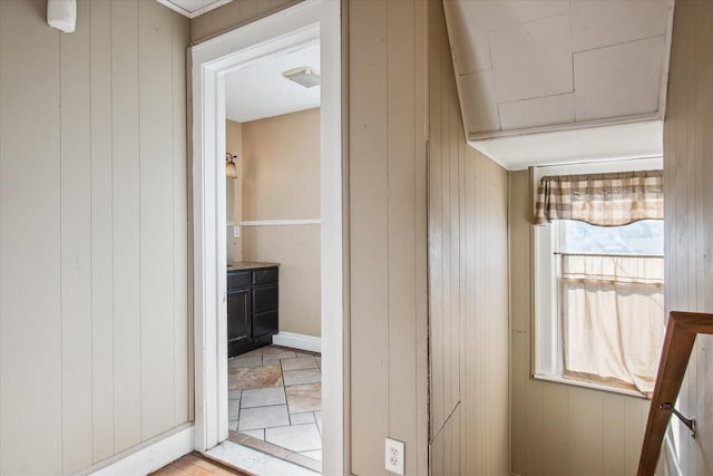 interior space featuring wood walls