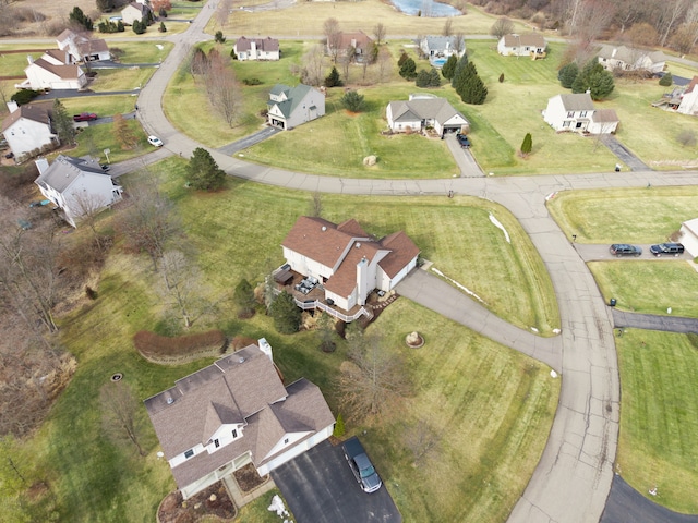 birds eye view of property with a residential view