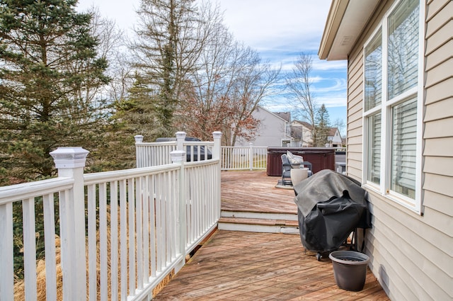 wooden terrace featuring area for grilling