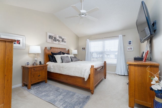 bedroom featuring vaulted ceiling, ceiling fan, baseboards, and light colored carpet