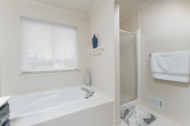 bathroom featuring a garden tub, a shower stall, visible vents, and crown molding