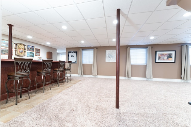 bar featuring a dry bar, recessed lighting, a paneled ceiling, light carpet, and baseboards