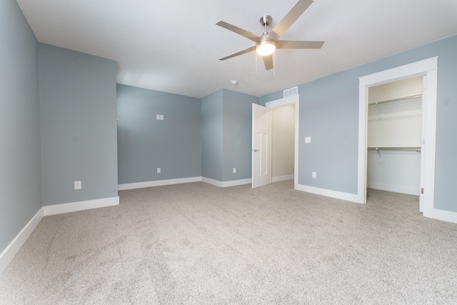 unfurnished bedroom featuring light carpet, visible vents, and baseboards