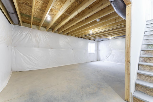 basement featuring stairs