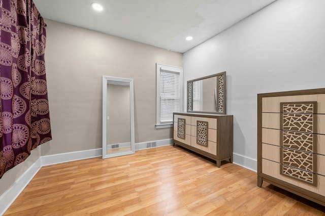 interior space with recessed lighting, baseboards, visible vents, and light wood finished floors