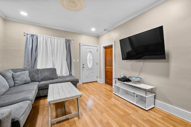 living area with ornamental molding, recessed lighting, baseboards, and wood finished floors