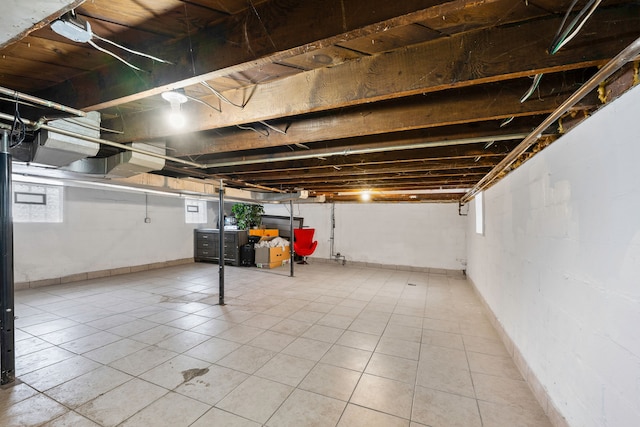 basement featuring tile patterned flooring