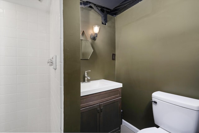 bathroom featuring toilet and vanity