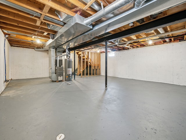 basement with heating unit and gas water heater