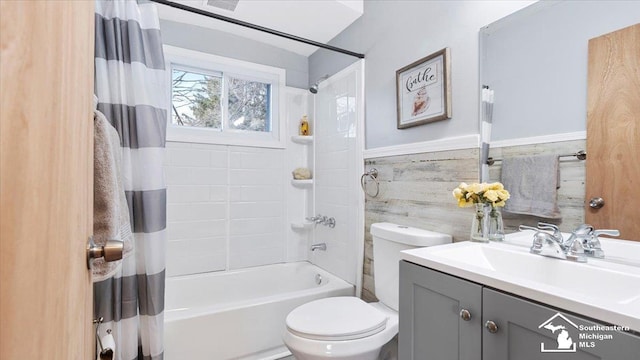 full bath featuring vanity, toilet, and shower / bathtub combination with curtain