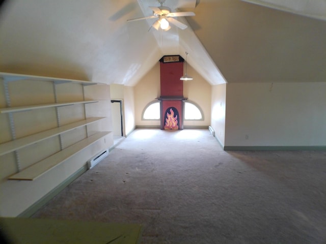 bonus room featuring visible vents, a ceiling fan, carpet flooring, vaulted ceiling, and baseboards