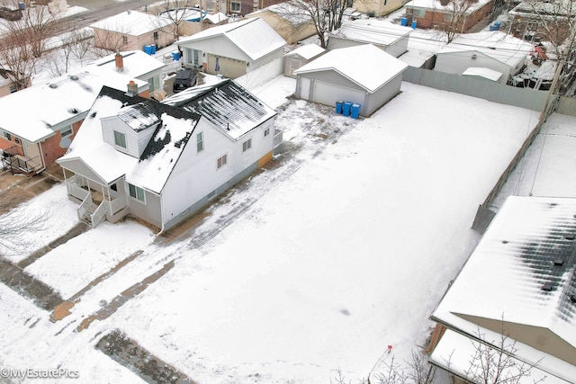 snowy aerial view with a residential view