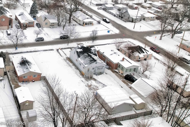 snowy aerial view featuring a residential view