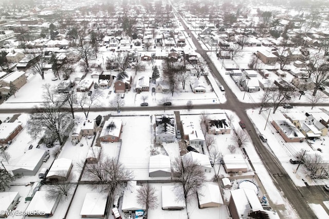 snowy aerial view featuring a residential view