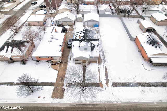 snowy aerial view featuring a residential view