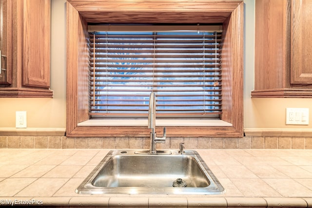 room details with tile counters and a sink