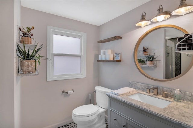 bathroom with toilet and vanity