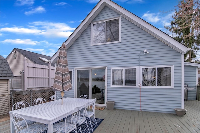 wooden deck featuring outdoor dining area