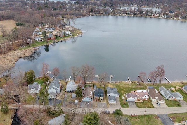 birds eye view of property with a residential view and a water view