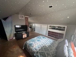 bedroom with lofted ceiling