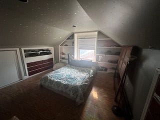 bedroom featuring lofted ceiling