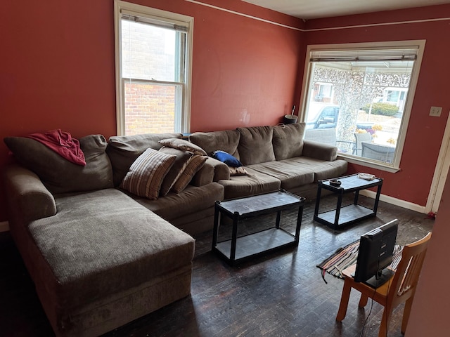 living area featuring dark wood finished floors and baseboards