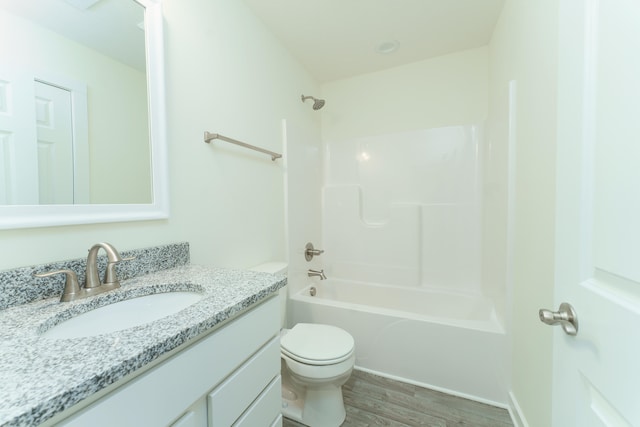 5124 Huggins Rd, Michigan Center, MI 49254 - full bathroom with shower / bath combination, vanity, toilet, and wood finished floors