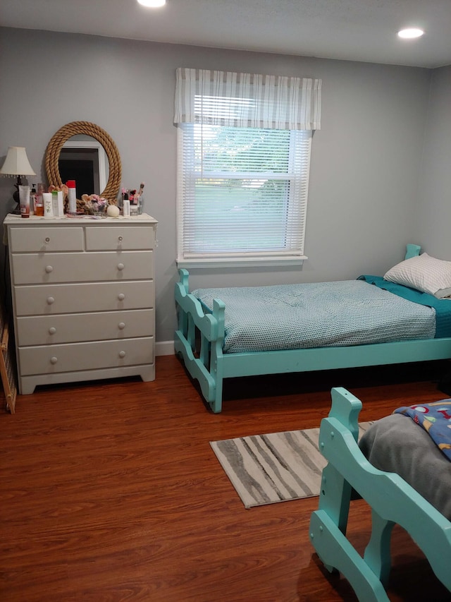 bedroom featuring recessed lighting, wood finished floors, and baseboards
