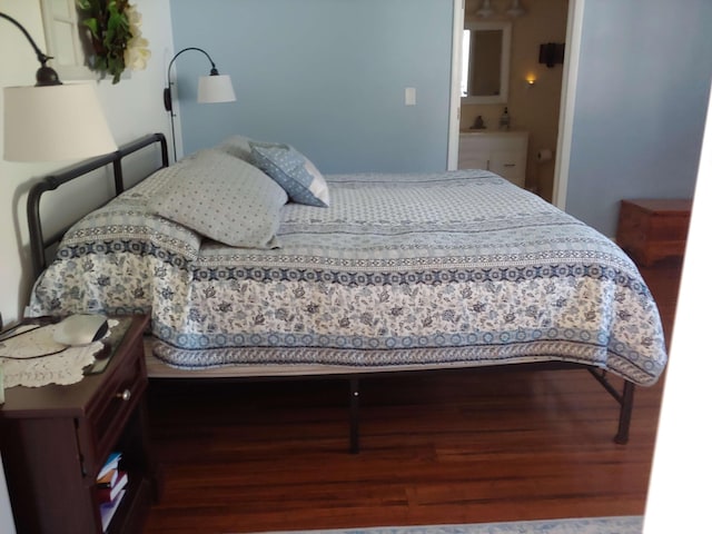 bedroom featuring wood finished floors