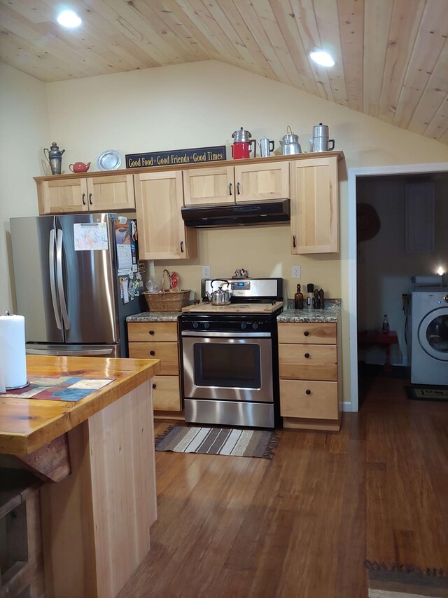 kitchen with light brown cabinets, lofted ceiling, washer / dryer, stainless steel appliances, and under cabinet range hood