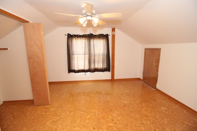 bonus room featuring baseboards, vaulted ceiling, and a ceiling fan