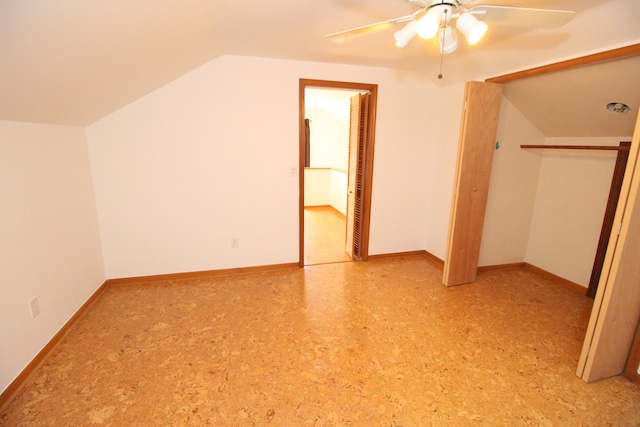 bonus room with lofted ceiling, ceiling fan, and baseboards