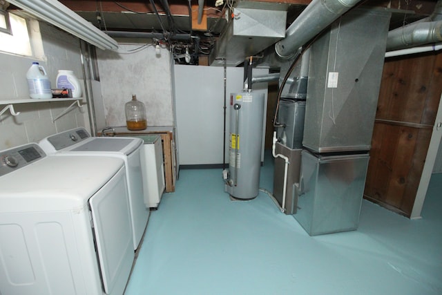 laundry area featuring laundry area, washer and clothes dryer, and gas water heater