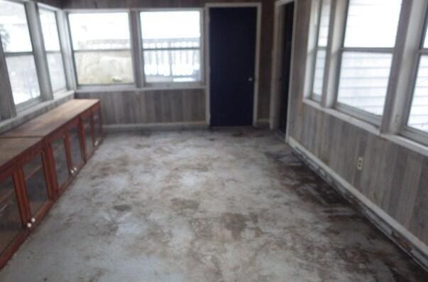 unfurnished sunroom with a wealth of natural light