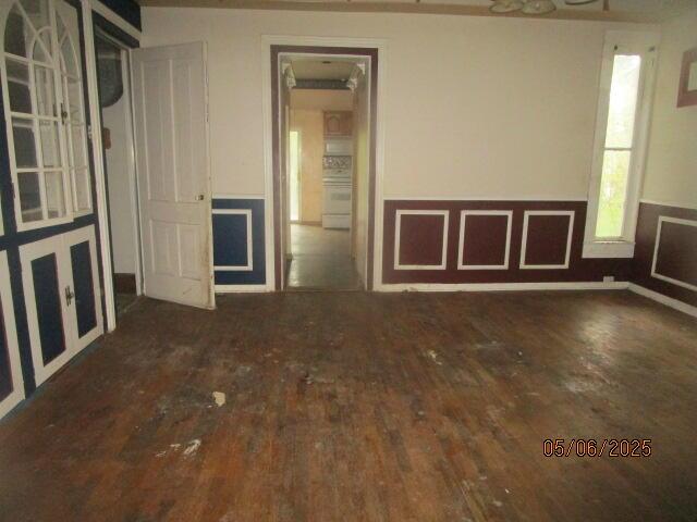 408 W Burr Oak St, Centreville, MI 49032 - spare room featuring wainscoting and wood finished floors