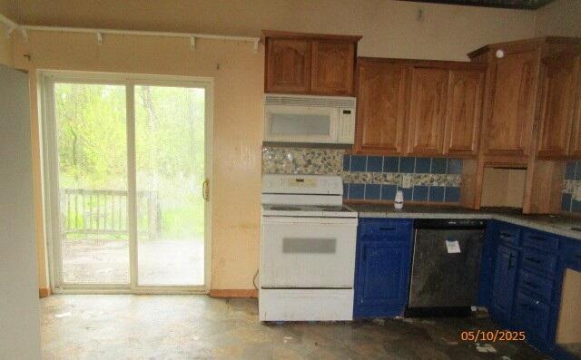 408 W Burr Oak St, Centreville, MI 49032 - kitchen featuring white appliances, tasteful backsplash, and brown cabinetry