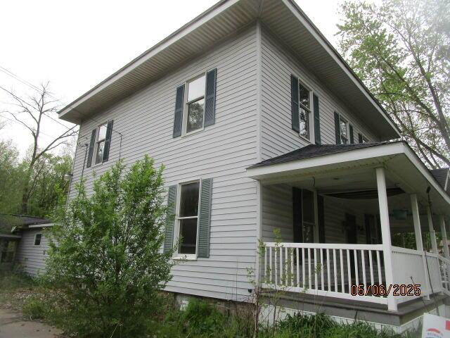 408 W Burr Oak St, Centreville, MI 49032 - view of property exterior featuring covered porch
